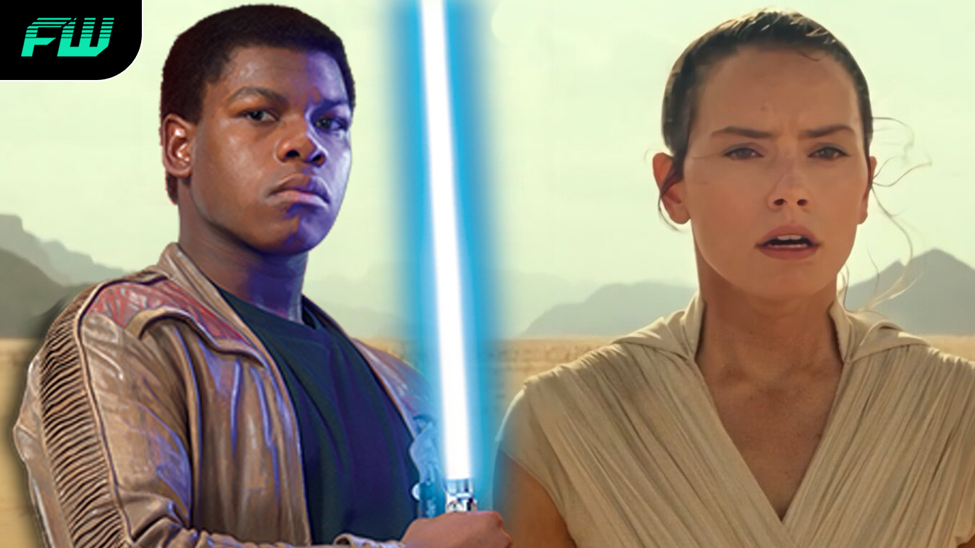Finn with a lightsaber and Rey in Star Wars: The Rise of Skywalker