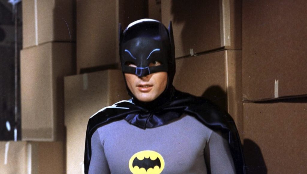 The original Batman Adam West in the iconic Dark Knight costume