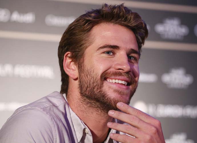 Liam Hemsworth, who had a near death experience while surfing