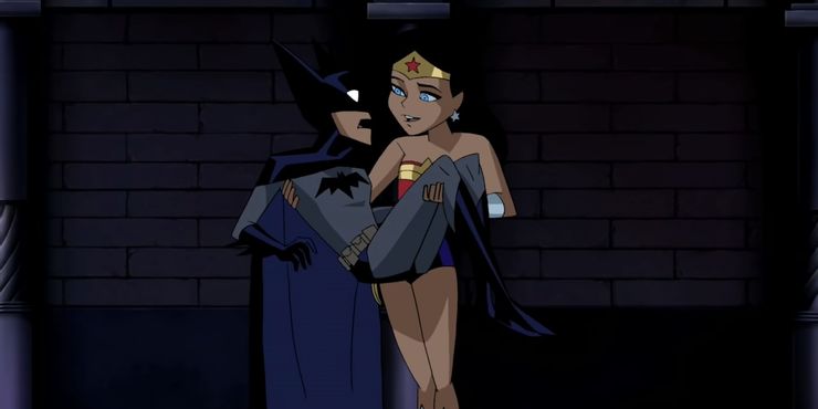 Batman in the arms of Wonder Woman.