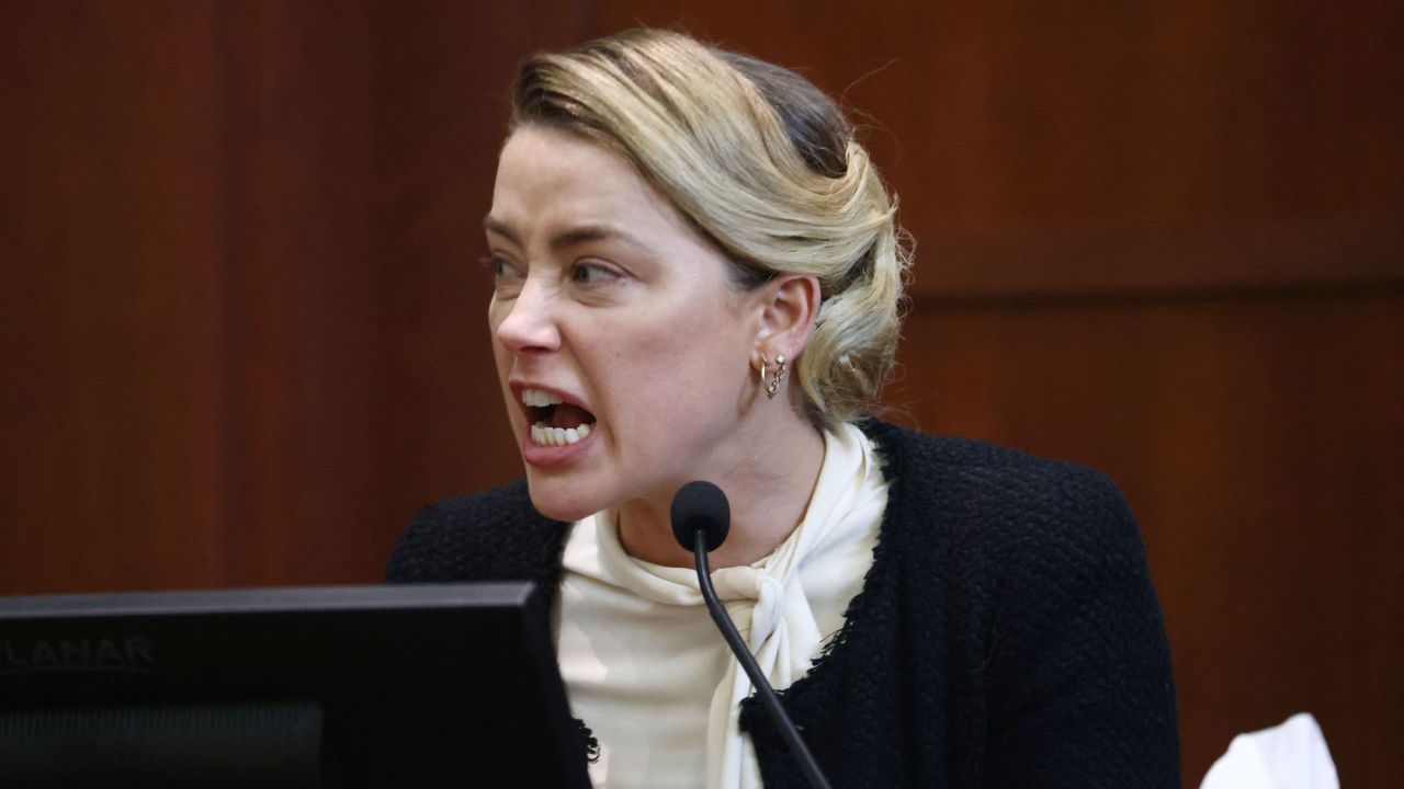 Amber Heard denies smiling when Johnny Depp's lawyer calls her out