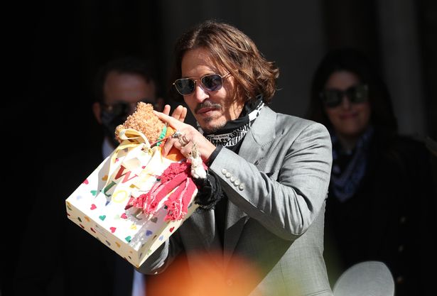 Johnny Depp receiving gifts from fans