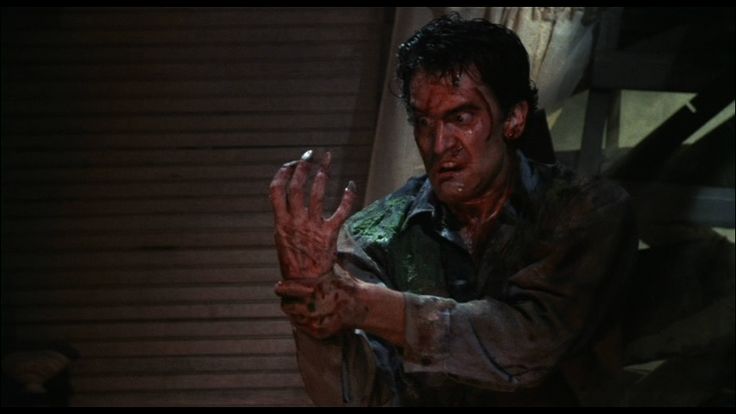 Bruce Campbell and his possessed hand in Evil Dead 2.