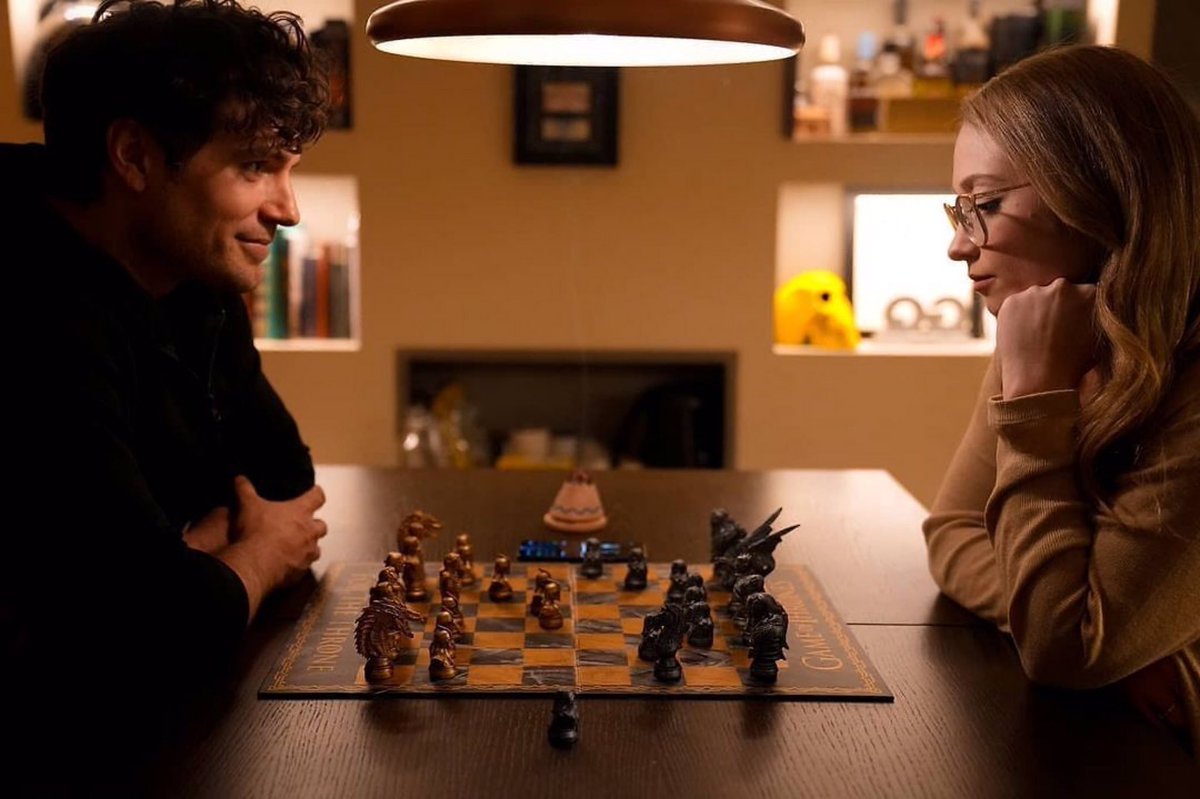 Henry Cavill and Natalie Viscuso playing Chess.