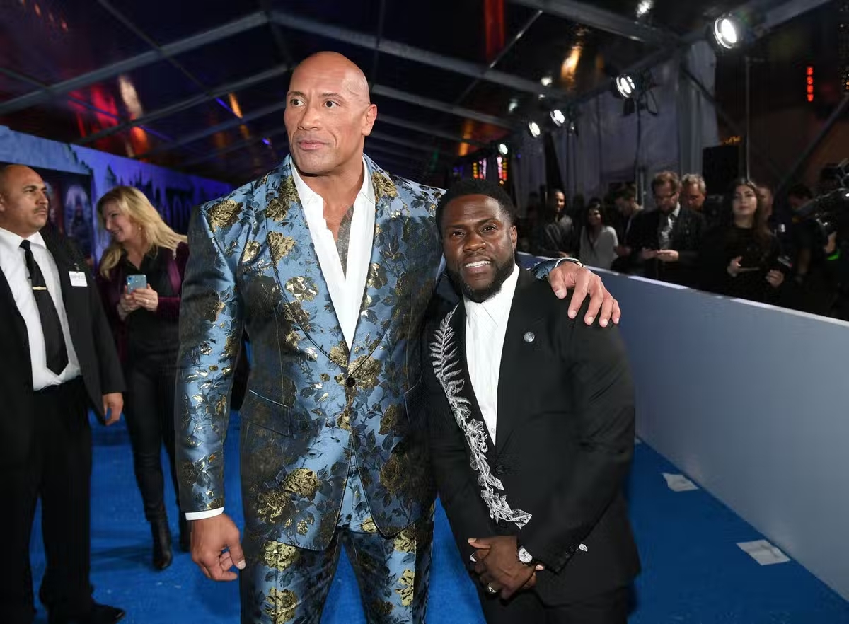 Kevin Hart and Dwayne Johnson seen at a ceremony.