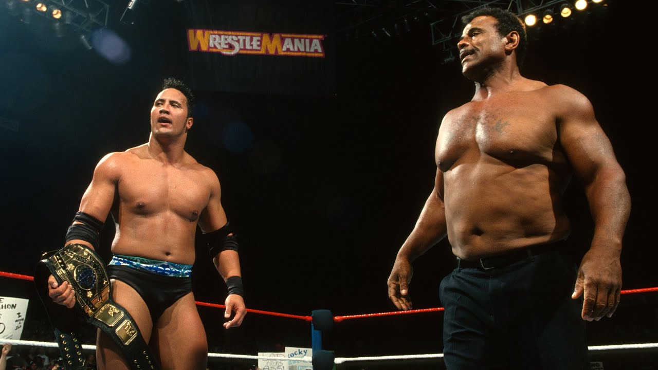 The Rock in the ring with Rocky Johnson during WrestleMania