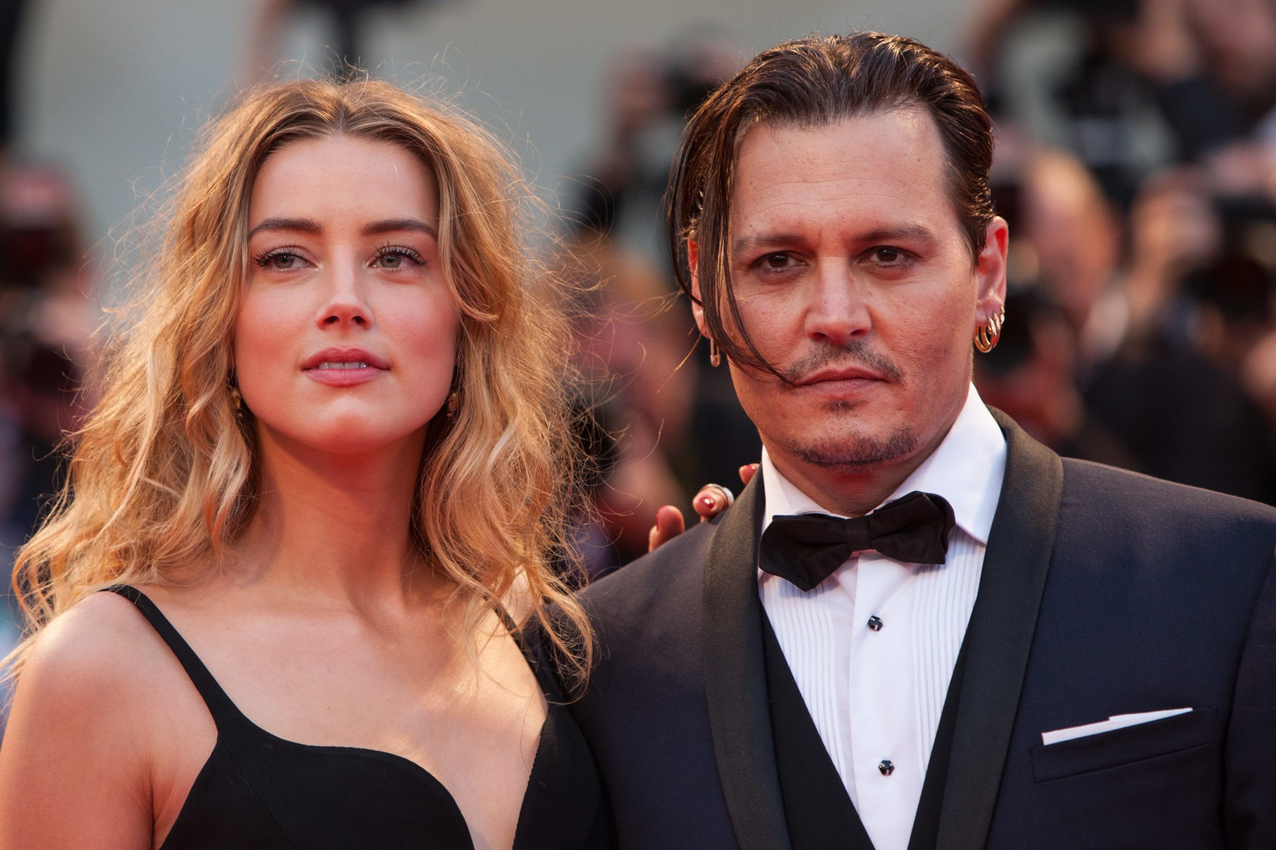 Amber Heard and Johnny Depp seen at a ceremony.