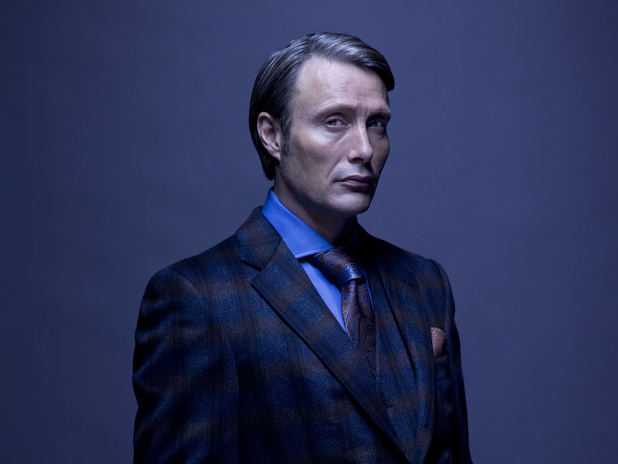 Mads Mikkelsen as Hannibal Lecter in Hannibal (2013-2015).