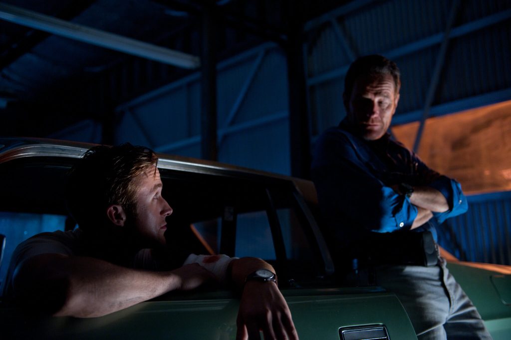 Gosling and Cranston in a still from the movie