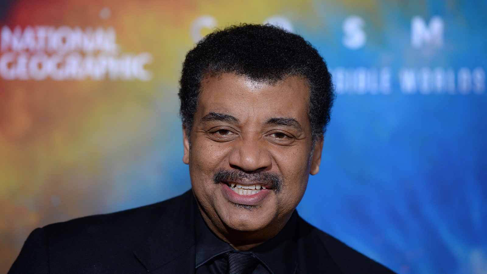Neil deGrasse Tyson smiling in this photo