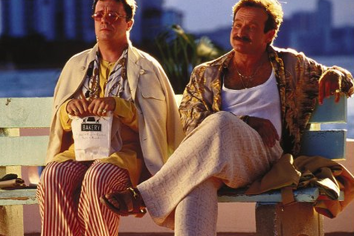 Robin Williams and Nathan Lane in The Birdcage sitting on a bench