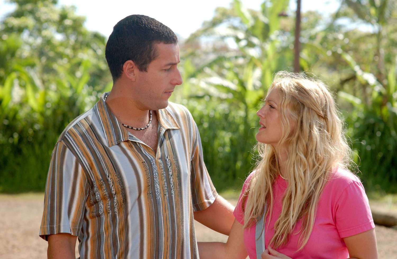 Adam Sandler and Drew Barrymore look at each other romantically 