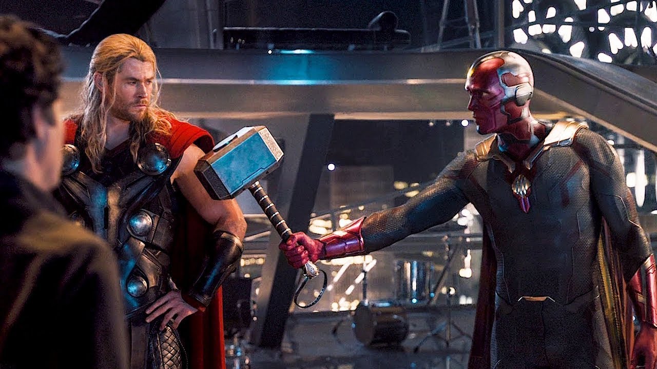 Vision gives Chris Hemsworth's Thor his Mjolnir back.