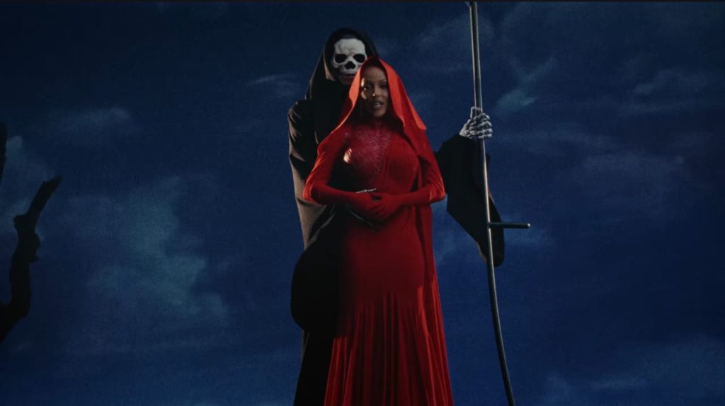 Doja Cat in her red attire in Paint The Town Red music video. 