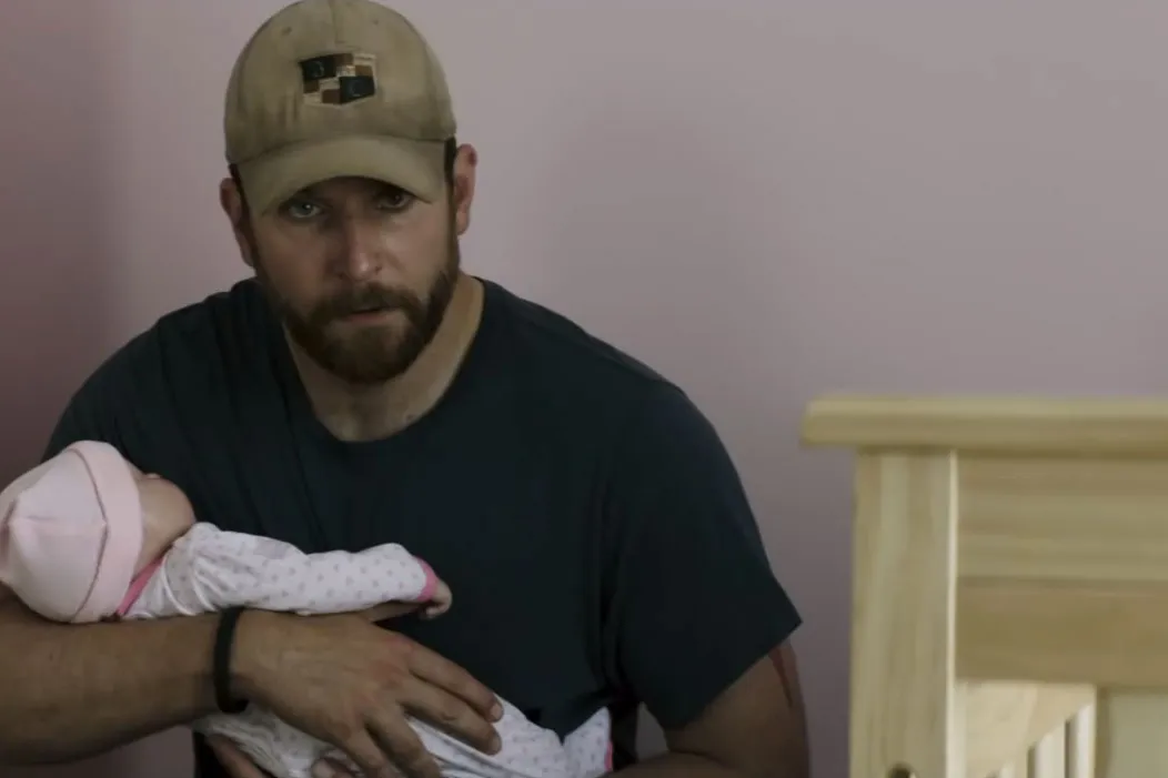 Bradley Cooper holding the fake baby in American Sniper
